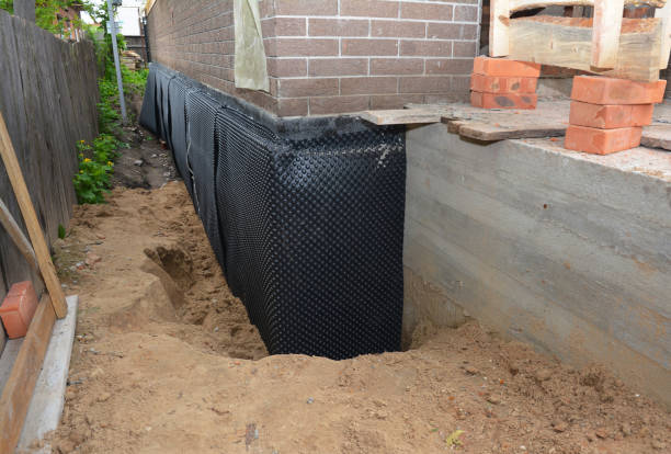 Happy homeowners after waterproofing job in Tallassee